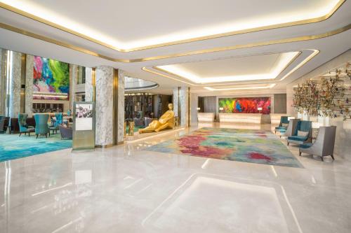 a lobby with a large rug on the floor at InterContinental Hotels Jakarta Pondok Indah by IHG in Jakarta