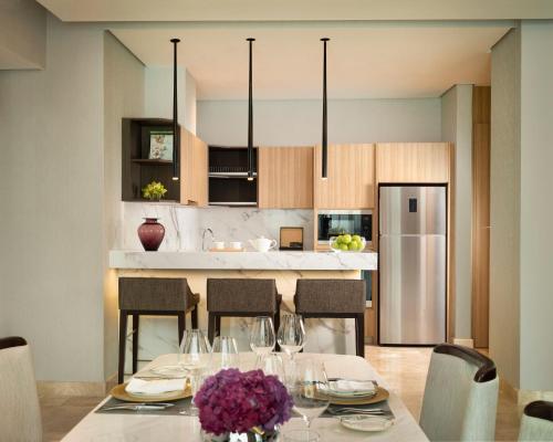 a dining room with a table with wine glasses at InterContinental Hotels Jakarta Pondok Indah by IHG in Jakarta