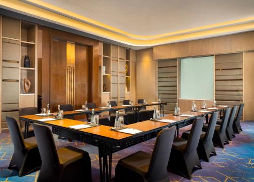 a large conference room with a long table and chairs at InterContinental Hotels Jakarta Pondok Indah by IHG in Jakarta