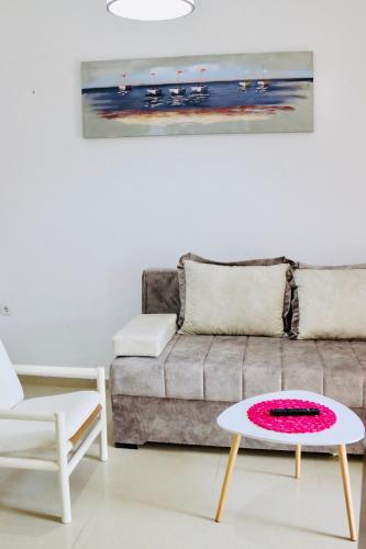 a living room with a couch and a table at Montebello Inn apartments in Ulcinj