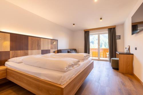 Postel nebo postele na pokoji v ubytování Hotel Piccolo