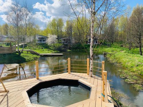 a plunge pool in the middle of a body of water at Brzozowisko Tuchomko in Tuchomko