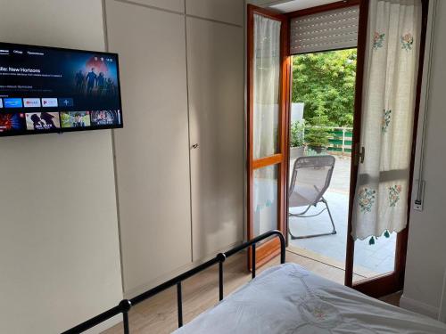 a bedroom with a bed and a television on a wall at Belappart in Fiuggi