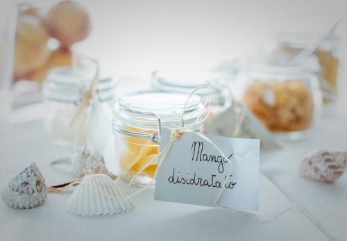 a table with a jar of honey and cookies at ALKIMIA boutique hotel in Vasto