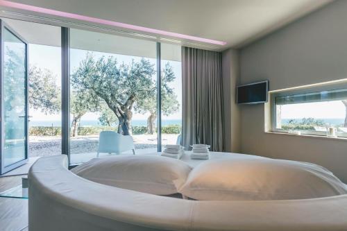 Postel nebo postele na pokoji v ubytování ALKIMIA boutique hotel