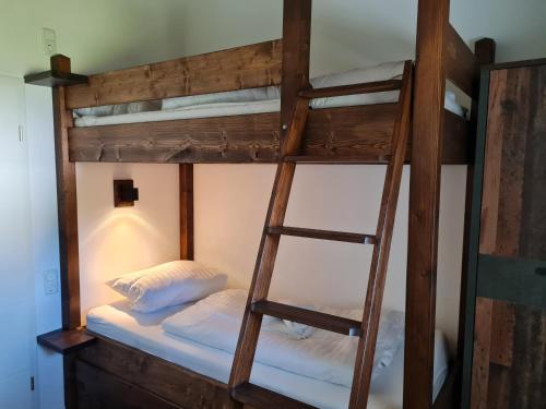 a bunk bed with two bunk beds in a room at Haus DeMa in Walkenried