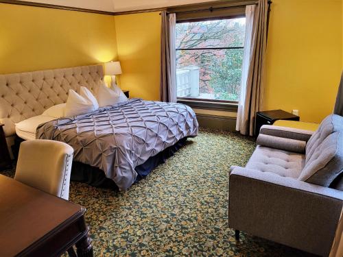 a hotel room with a bed and a window at Evermore Guesthouse in Portland