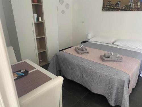 A bed or beds in a room at Dimora al Centro Home