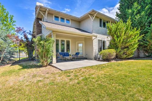 a house with a patio and a lawn at Charming Medford Getaway about 4 Miles to Downtown! in Medford