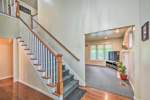 a home with a staircase and a living room at Charming Medford Getaway about 4 Miles to Downtown! in Medford
