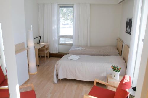 Postel nebo postele na pokoji v ubytování Hotel Norrvalla