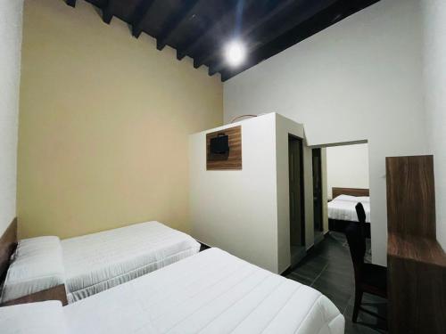 Voodi või voodid majutusasutuse La Casona Real toas