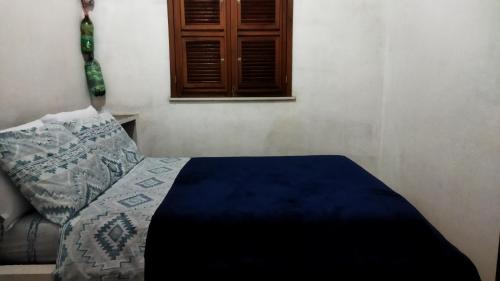 Ένα ή περισσότερα κρεβάτια σε δωμάτιο στο Casa da Vó