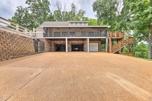 an empty driveway in front of a house at Pickwick Lake Home with Screened-In Porch, Dock in Counce