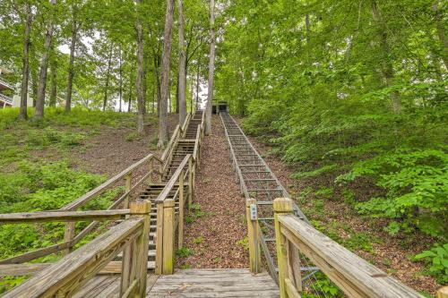 a wooden bridge in the middle of a forest at Pickwick Lake Home with Screened-In Porch, Dock in Counce