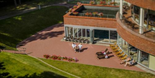 an overhead view of a building with people sitting on a patio at Royal SPA Residence in Birštonas