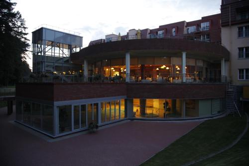 a large building with a lot of windows at Royal SPA Residence in Birštonas