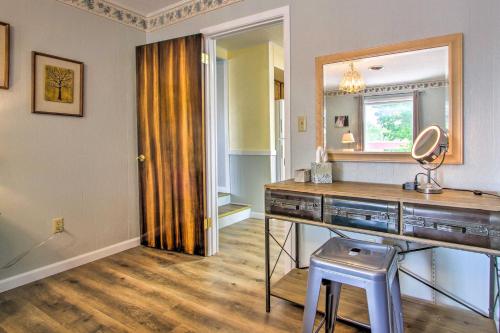 a room with a dressing table and a mirror at Charming Choteau Apartment Central Location! in Choteau