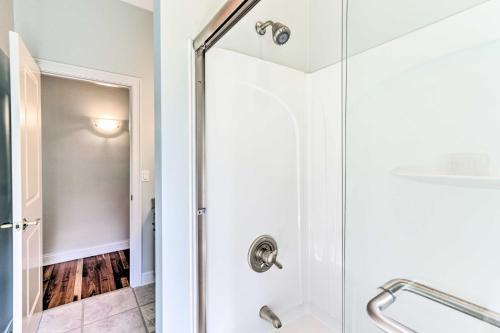 a shower with a glass door in a bathroom at Elegant Middlefield Getaway with Game Room! in Middlefield