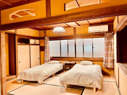 Llit o llits en una habitació de Minasama Oyado Shimakaze