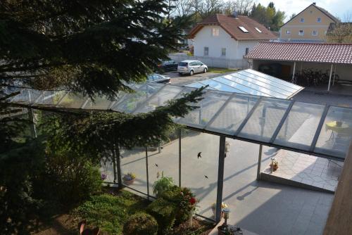 an aerial view of a building with a glass roof at Kurpension Gundula in Bad Füssing