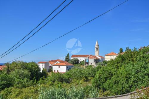 a town on a hill with a clock tower at Apartment S and E in Kali