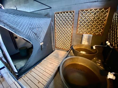 a bathroom with a brown toilet in a room at 貸切御宿Villa EL 5 Nikko Kinugawa Area in Nikko