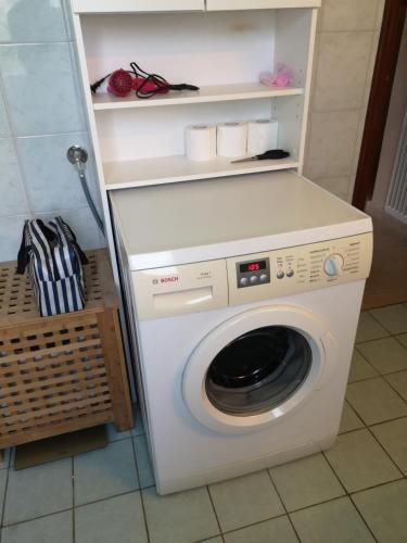 a white washer and dryer in a room at Aegean Sea Home in Nea Makri