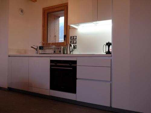 a kitchen with a counter with a sink and a mirror at Chalet Saint-Martin-de-Belleville, 4 pièces, 6 personnes - FR-1-344-731 in Saint-Martin-de-Belleville