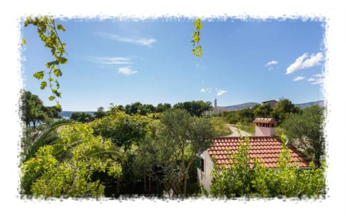 a view of a house with a roof at Hostel Oktarin in Kaštela