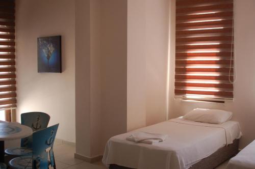 Ένα ή περισσότερα κρεβάτια σε δωμάτιο στο Astoria Life Hotel