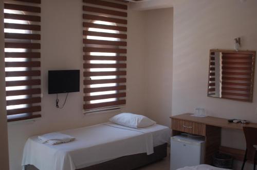 Ένα ή περισσότερα κρεβάτια σε δωμάτιο στο Astoria Life Hotel