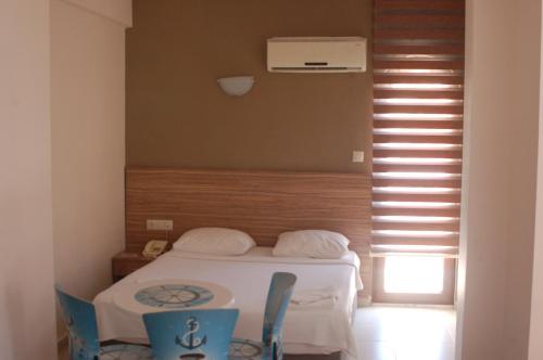 Ένα ή περισσότερα κρεβάτια σε δωμάτιο στο Astoria Life Hotel
