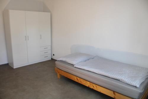 Postel nebo postele na pokoji v ubytování Dluhonska Apartments