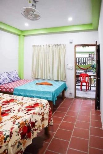 Ein Bett oder Betten in einem Zimmer der Unterkunft Villa Koh Rong