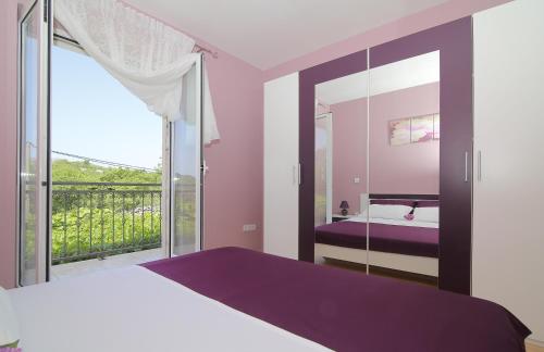 Postel nebo postele na pokoji v ubytování Apartment Moretić