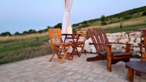 a table and chairs sitting on a patio at Mera Hills House in Mera