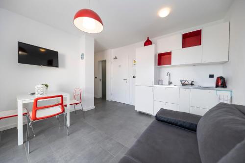a living room with a couch and a table and a kitchen at Mama House Villa in Novalja