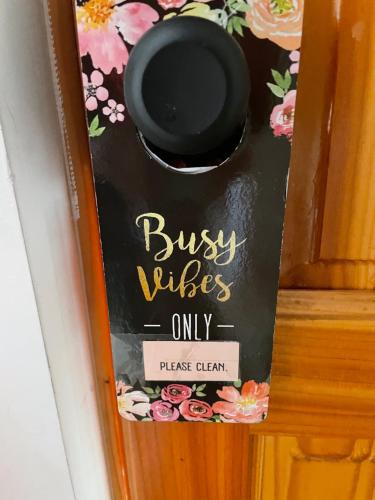 a sign on a door that reads busy wives onlypick client at Hotel Pacífic Suites Tocopilla in Tocopilla