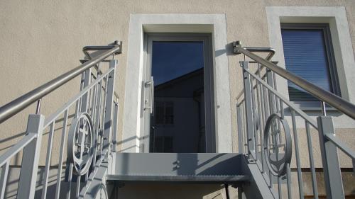 an open door on a building with a balcony at Villa Rosalie Sassnitz in Sassnitz