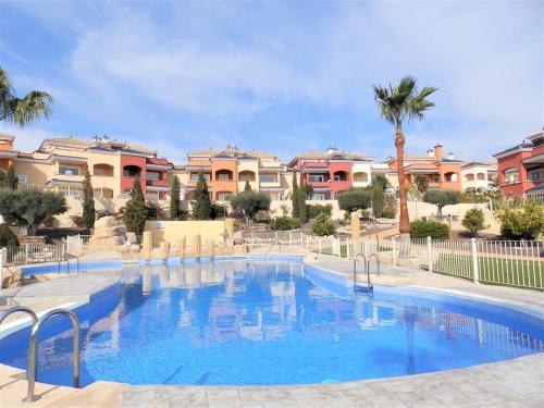 a large swimming pool in front of some apartments at Bajo Amparo Altaona Golf in Murcia