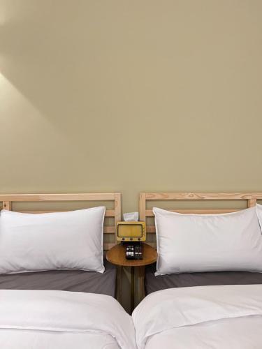 Una cama o camas en una habitación de 宸村民宿