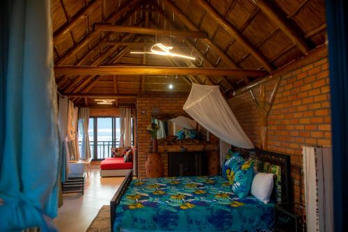 a bedroom with a bed in a room at Hakuna Matata Lodge in Gisenyi