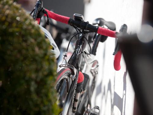 a group of bikes parked next to a wall at Hotel Brauerei Frohsinn in Arbon