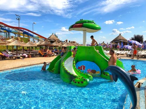 a slide in a pool at a resort at S Club Resort Hotel Aqua Park and Spa in Belgrade