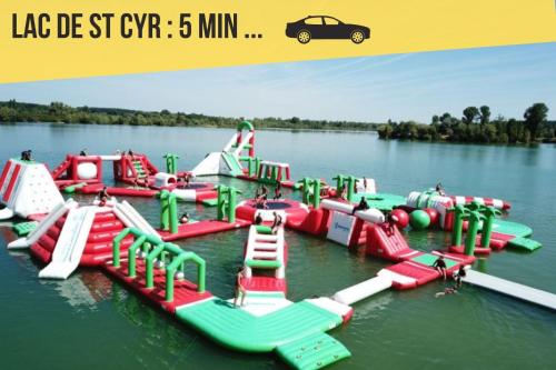 a bunch of inflatable play equipment in the water at Appartement entier meublé à Beaumont proche Futuroscope et Poitiers Technopole in Beaumont