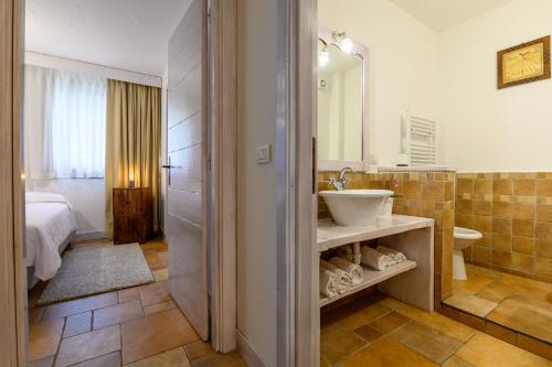 a bathroom with a sink and a toilet and a shower at Alpesmith - Bike & Ski apartments in Bardonecchia