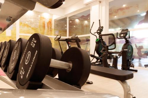 a row of exercise bikes in a gym at Hotel Baviera in Cala Ratjada