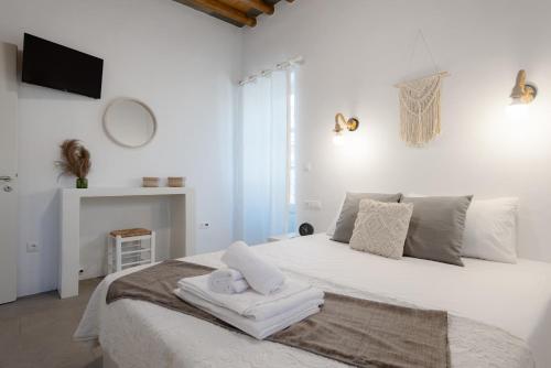 Ένα ή περισσότερα κρεβάτια σε δωμάτιο στο Tholos Guest House