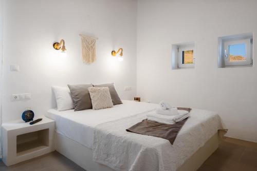 Ένα ή περισσότερα κρεβάτια σε δωμάτιο στο Tholos Guest House